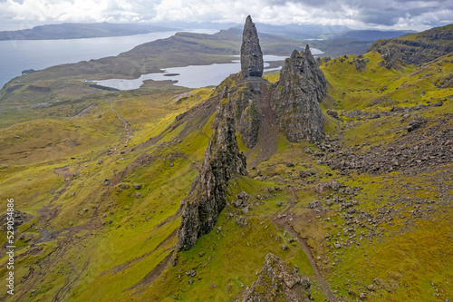 The Old Man of Storr atop the Trotternish Ridge above the Sound of Rasaay on the Isle of Skye in Scotland.  photo