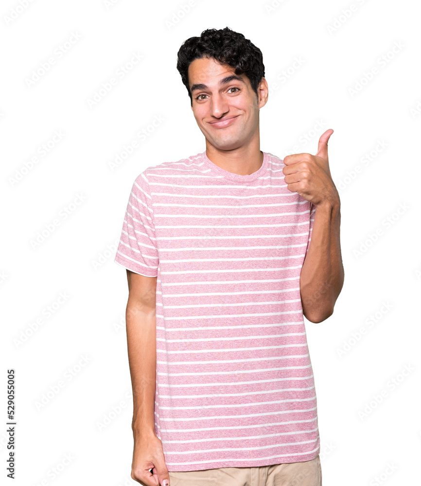 Hesitant young man gesturing that everything is fine Hesitant young man gesturing that everything is fine