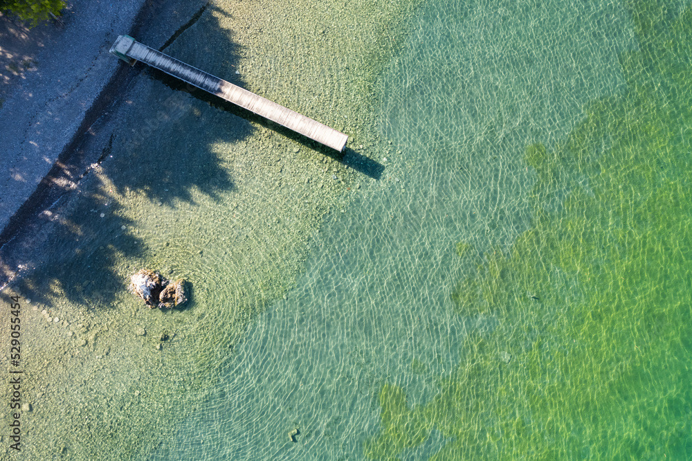Φωτογραφία Straight view on pier of the air on the shore of Ohrid lake in Summer with cryst