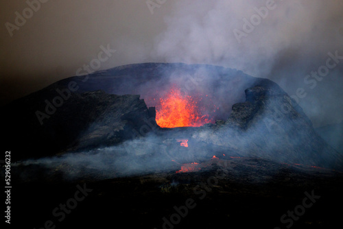 Lava erupts from the Geldingadalir eruption of the Fagradalsfjall tuya volcano in Iceland in June of 2021. photo