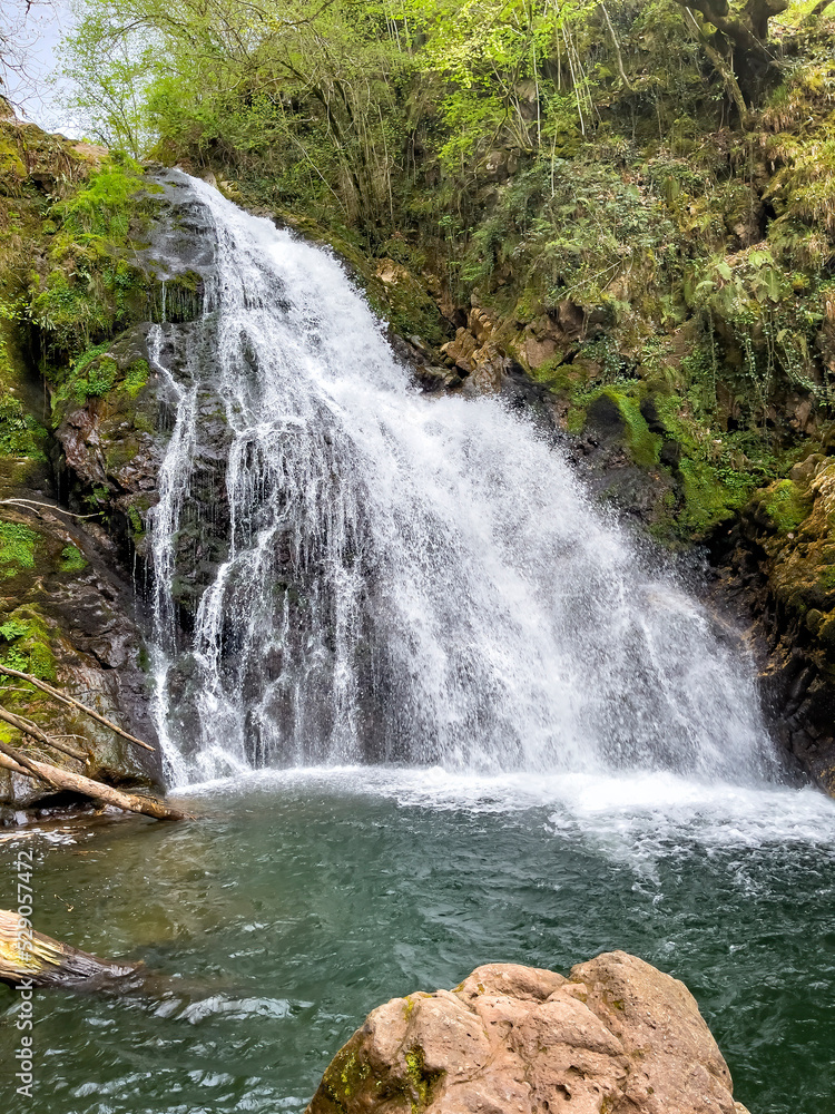 Obraz premium waterfall in a wet forest, Xorroxin waterfall in Erratzu, Baztan Valley, Navarra, Spain