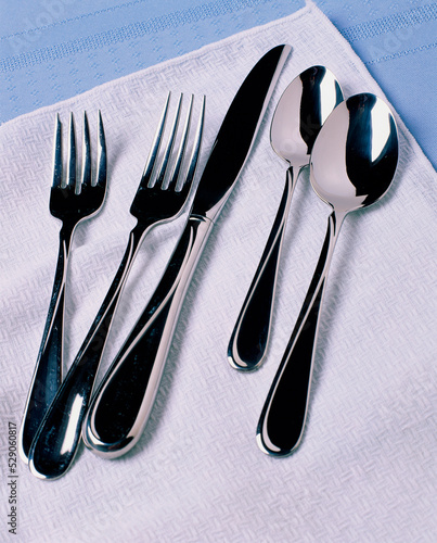 Close-up of forks with knives and spoons photo