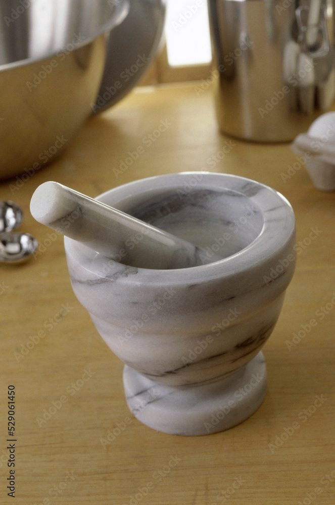 Close-up of a mortar and a pestle Close-up of a mortar and a pestle
