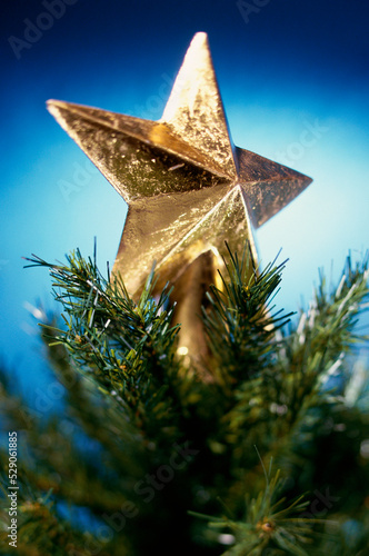 Close-up of a Christmas star on top of Christmas tree