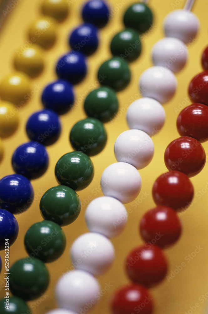 Colored beads of an abacus Colored beads of an abacus