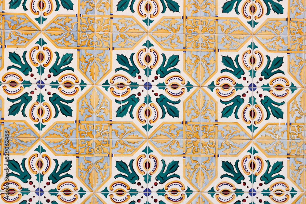 Mosaic of classical ornamental tiles with flowers and golden details