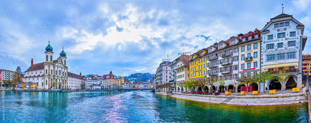 Panorama of old buildings on banks of Reuss river of Altstadt neighborhood in Lucerne, Switzerland
