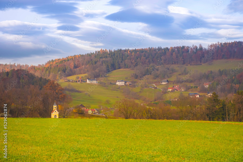 Agricultural fields and yellow little chapel in the charming town of Rein (famous for the beautiful Rein Abbey) near Graz, Steiermark, Austria