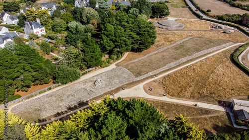Aerial view of the Locmariaquer megalithic site near Carnac in Brittany, France - Prehistoric Er grah tumulus made out of limestone in Morbihan