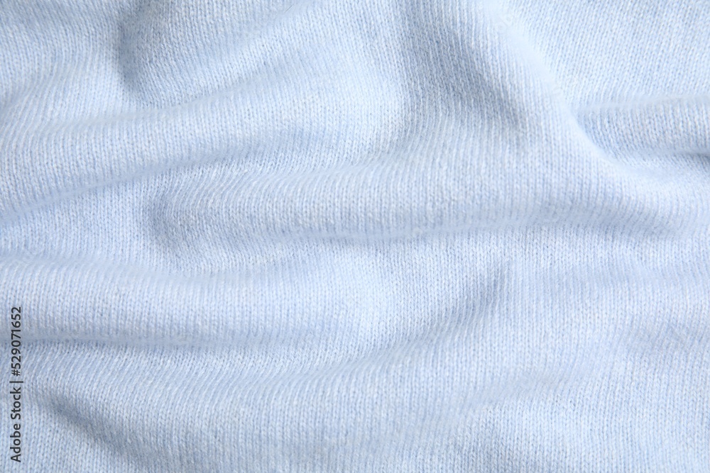 Fototapeta premium Warm cashmere sweater as background, top view