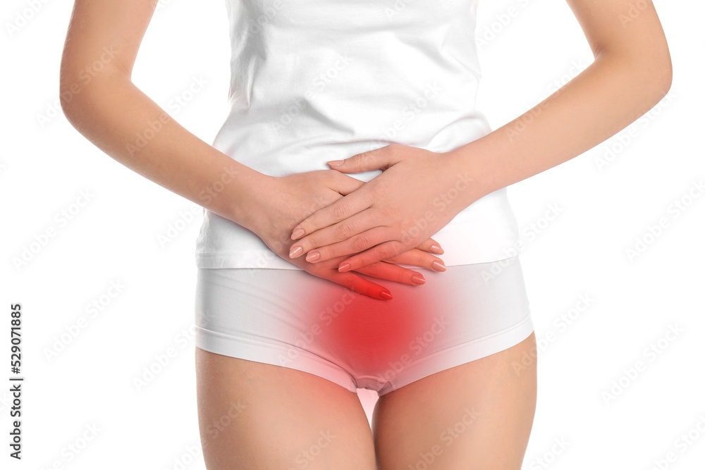 Woman holding hands on her belly against white background, closeup. Vaginal yeast infection