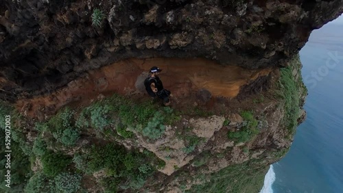 A strong and active man is walking on the trail up to Quebrada do Negro in Madeira.