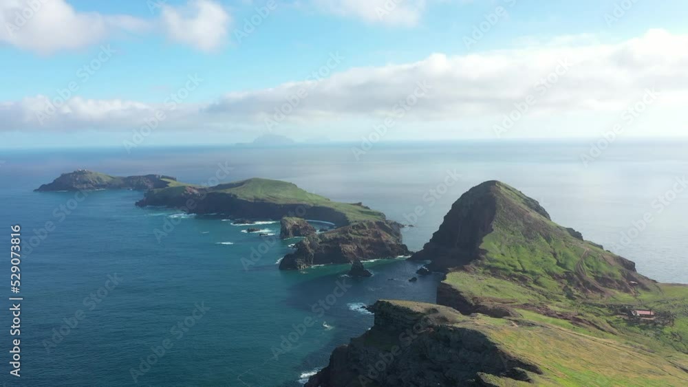 Drone shot over the peninsula and small islands coming out from mainland Madeira in daytime. Drone shot over the peninsula and small islands coming out from mainland Madeira in daytime.
