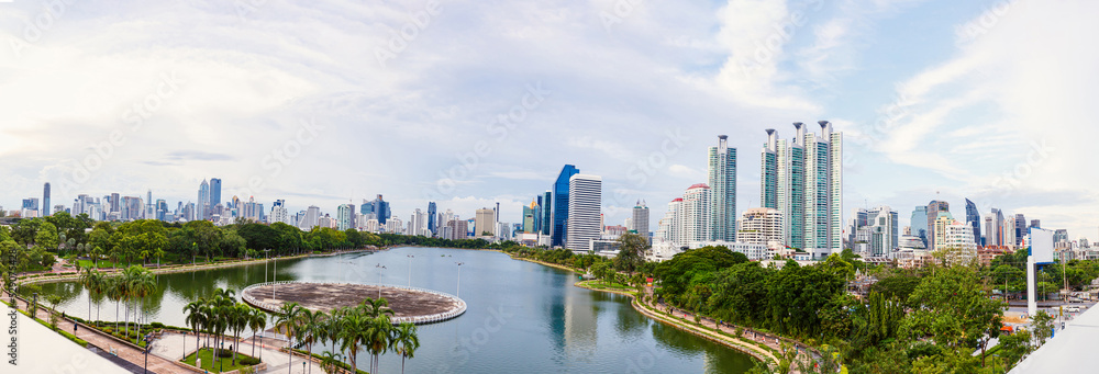Fototapeta premium Panorama view of Benjakitti Park in the afternoon. The park is a public park in the Khlong Toei District of central, situated next to the Queen Sirikit National Convention Center. Bangkok, Thailand