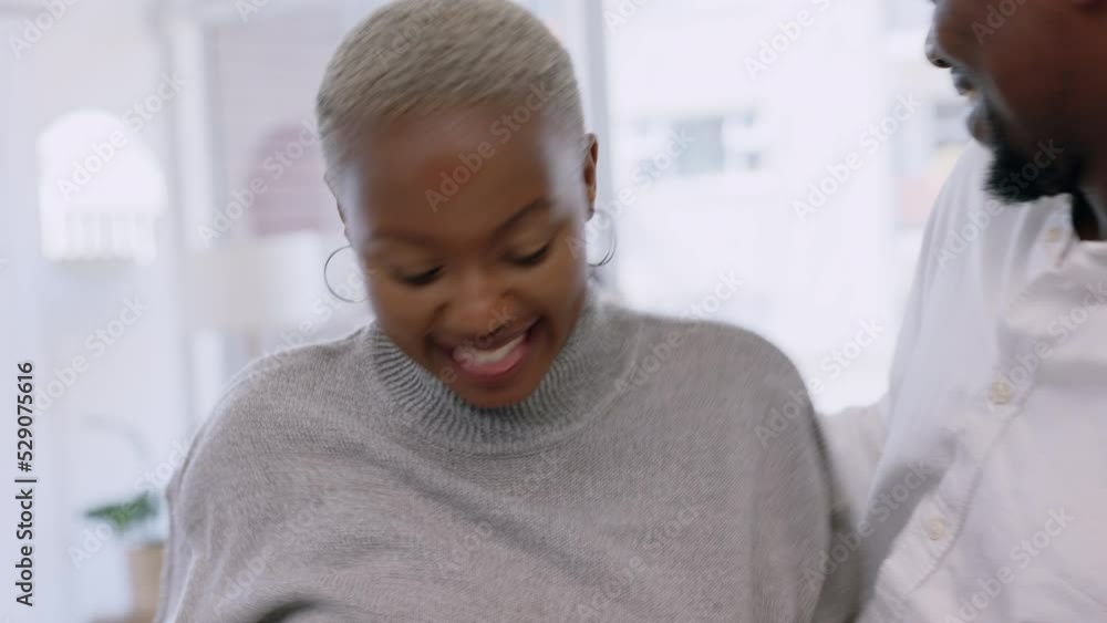 Black couple, happy and dance with music in living room fun, playful and happiness together at home. African man and woman dancing with smile and laughing in bonding time and celebrating relationship Black couple, happy and dance with music in living room fun, playful and happiness together at home. African man and woman dancing with smile and laughing in bonding time and celebrating relationship