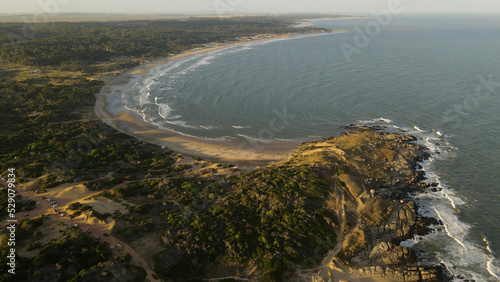 Beautiful Panoramic shot of Playa Grande beach at sunset in Uruguay. Blue water and yellow sandy beaches