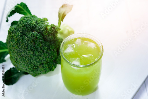 Glass of broccoli juice, broccoli Healthy drink on wood back ground, Green vegetable smoothie