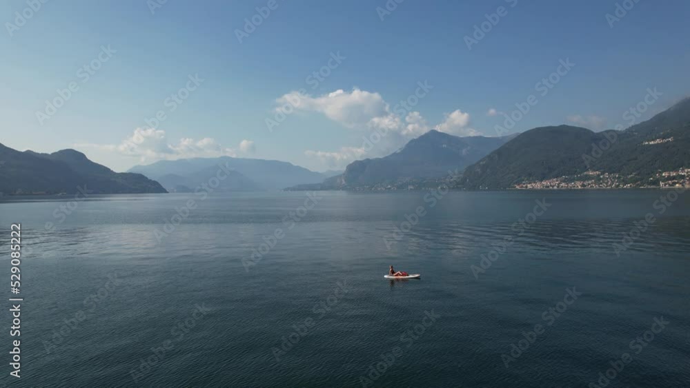Aerial view of a person doing canoe in the Como Lake, Italy. Aerial view of a person doing canoe in the Como Lake, Italy.