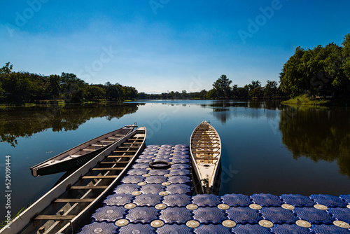 Wooden boats moored on the shore in the midst of beautiful nature.