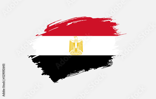 Creative hand drawn grunge brushed flag of Egypt with solid background