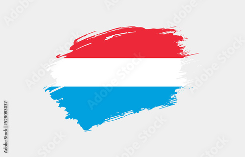 Creative hand drawn grunge brushed flag of Luxembourg with solid background