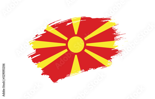 Creative hand drawn grunge brushed flag of North Macedonia with solid background