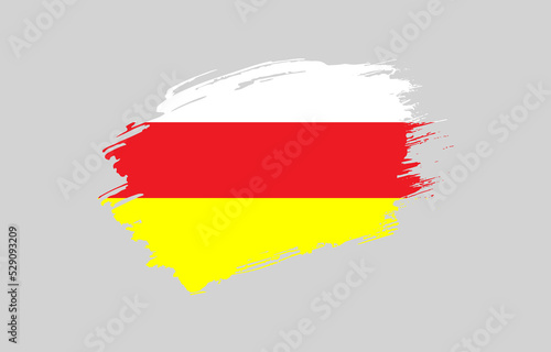 Creative hand drawn grunge brushed flag of North Ossetia with solid background