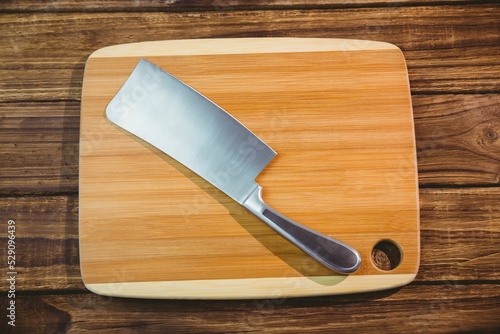 Overhead view of large knife and chopping board 