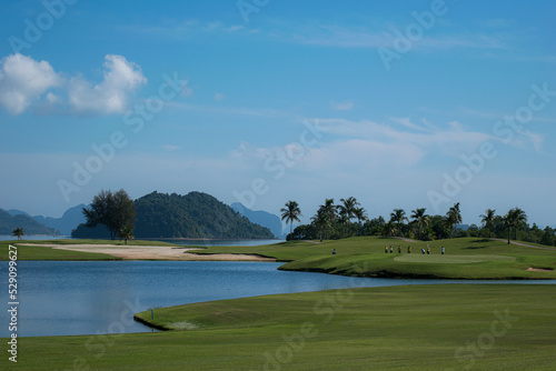 river on golf course in blue sky