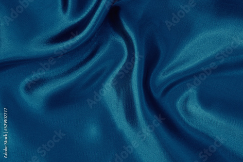Dark blue fabric cloth texture for background and design art work, beautiful crumpled pattern of silk or linen.