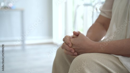 Wallpaper Mural Stressful elder woman sitting alone in the living room. Torontodigital.ca
