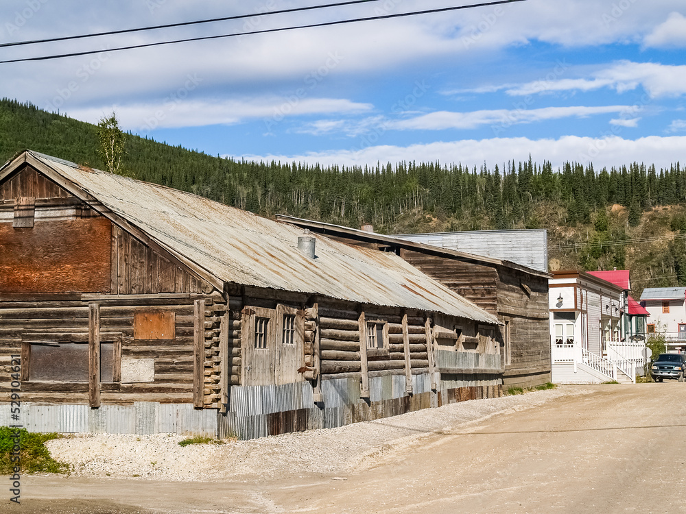 Log cabin style building in dusty town street in Yukon Territory, Dawson City. Log cabin style building in dusty town street in Yukon Territory, Dawson City.