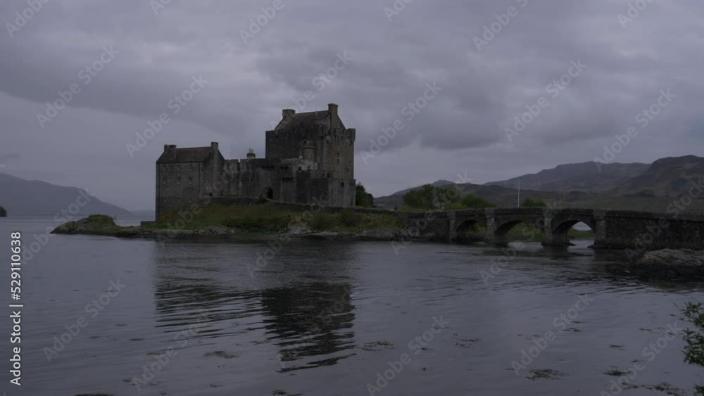 shot midway from Eilean Donan Castle on a cloudy day. Shot made in Scotland. shot midway from Eilean Donan Castle on a cloudy day. Shot made in Scotland.