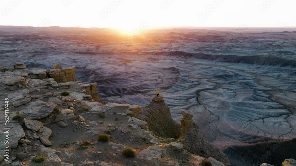 Drone Orbit Over Person At The Tip Of Sheer Canyons During Sunrise In The Utah, USA. Aerial Shot Drone Orbit Over Person At The Tip Of Sheer Canyons During Sunrise In The Utah, USA. Aerial Shot