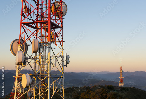 Antennas or telecommunication towers at sunrise on Mount Jaizkibel photo