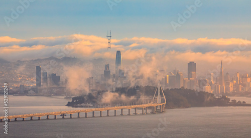 Bay Bridge and San Francisco with Karl the fog enveloping the city at sunset