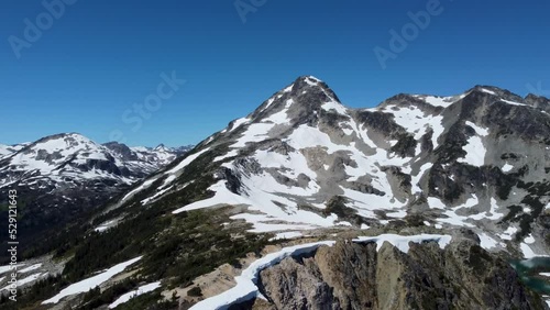 Wallpaper Mural Sugarloaf Mountain with Snow Pine Trees and Bright Blue Sky in Pacific Ranges Canada BC 4K - Sideways Drone Aerial Shot Torontodigital.ca