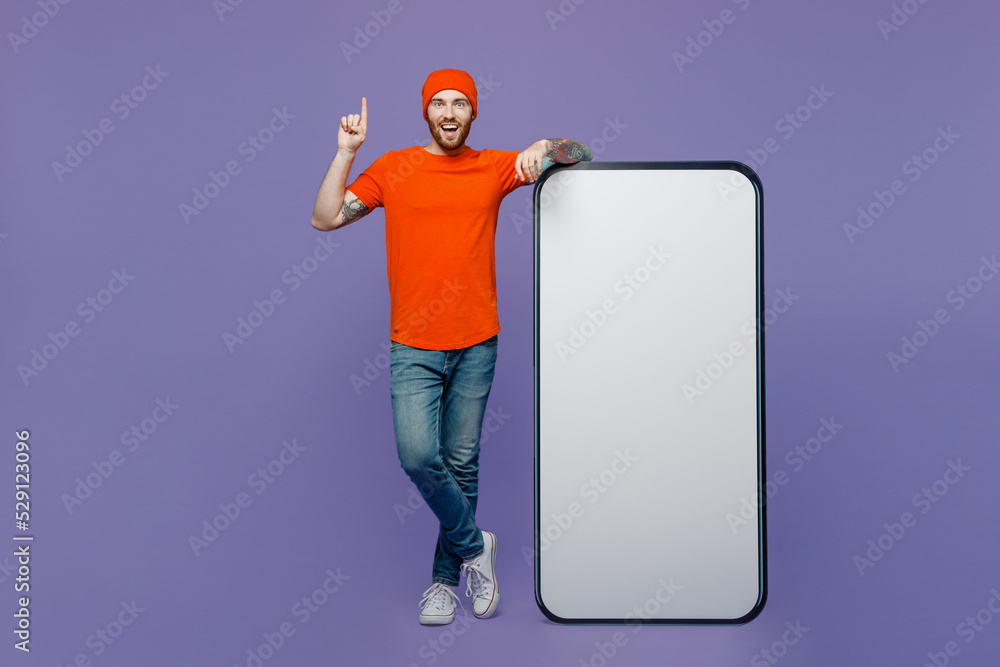 Full body insighted young man wear red hat t-shirt big huge blank ...