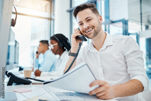Fotografia Telemarketing, sales or customer service worker smiling and talking on a telephone selling insurance