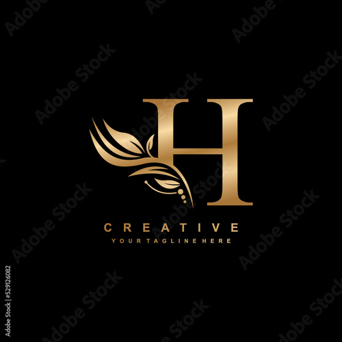 gold letter H logo design with luxurious and beautiful leaf ornament. H Monogram. H typography. gold feather logo. initial letter H logo