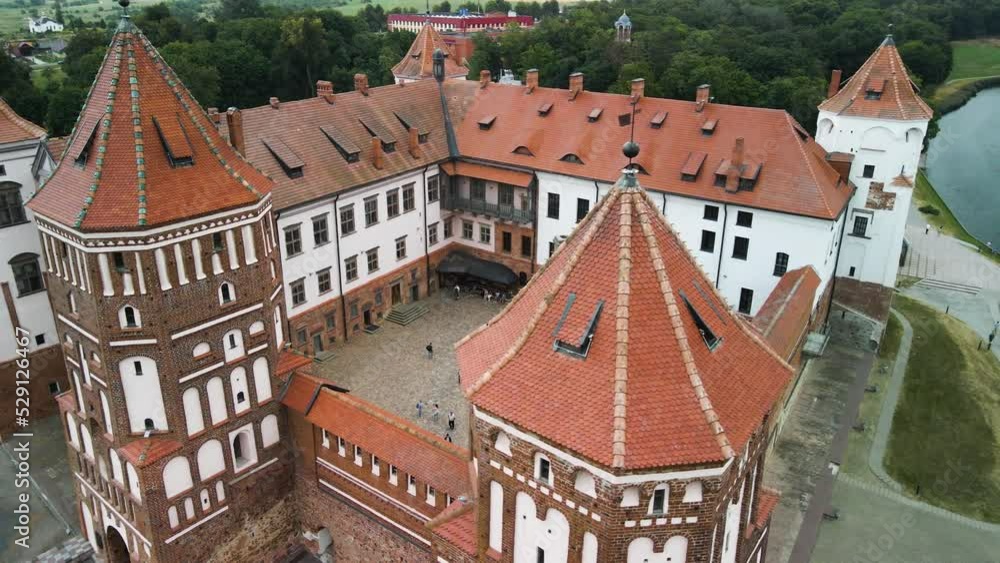 Smooth orbit shot of the mir castle filled with tourists in mir city belarus Smooth orbit shot of the mir castle filled with tourists in mir city belarus