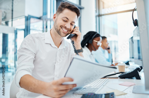 Fototapete Telemarketing training and web help man on an office phone consultation with a work script