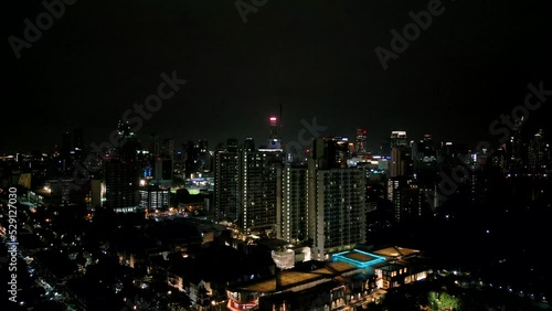 Wallpaper Mural 4K Cinematic urban drone footage of an aerial view of buildings and skyscrapers in the middle of downtown Bangkok, Thailand at night Torontodigital.ca