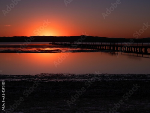 Sunset across Tuggerah Lake at Long Jetty NSW Australia photo