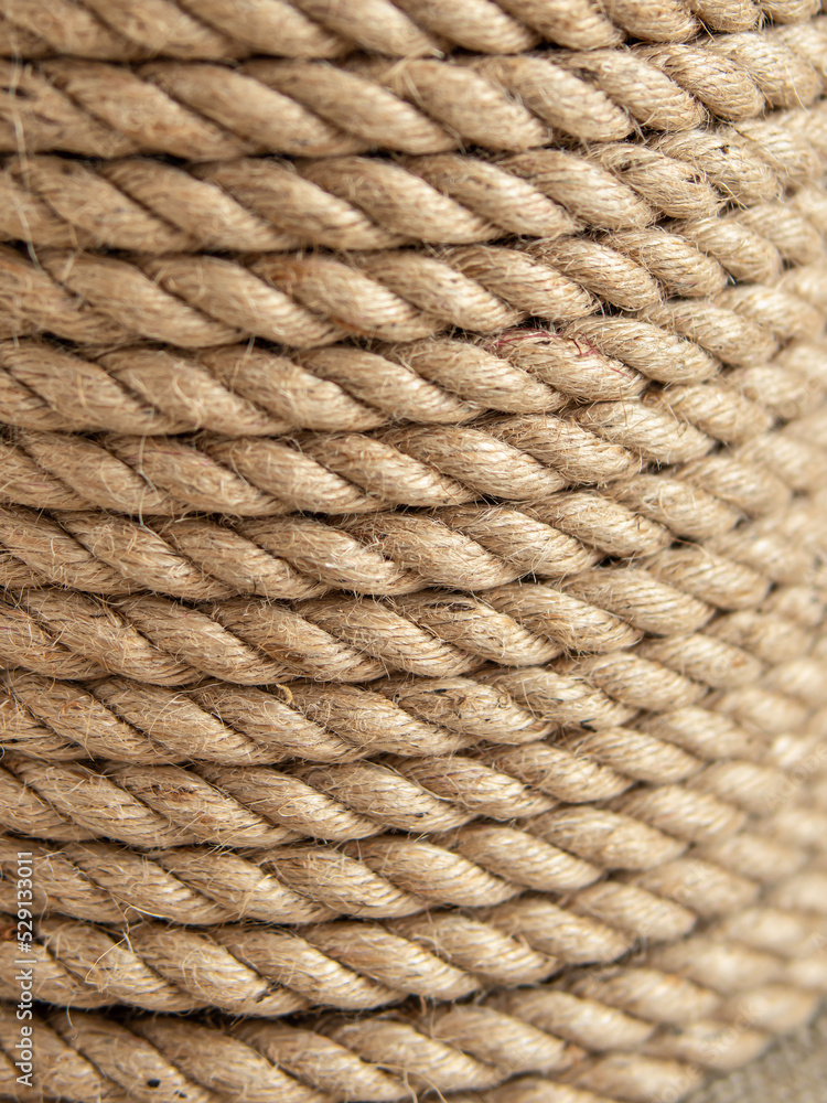 Fastening twine on canvas background. Natural. Jute rope closeup Fastening twine on canvas background. Natural. Jute rope closeup