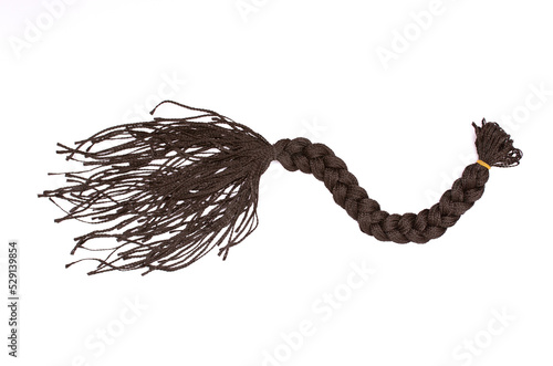 Dreadlocks close-up. Braided by a master hairdresser in the salon, hair braided in dreadlocks. African braids on a white background.
