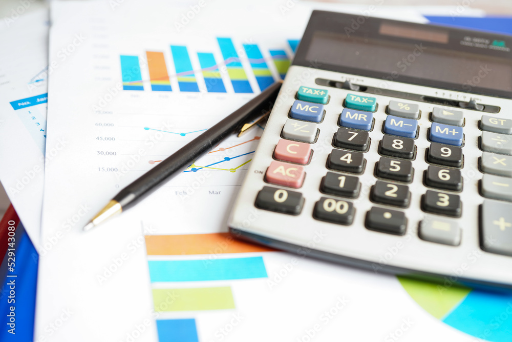 Calculator on chart and graph spreadsheet paper. Finance development, Banking Account, Statistics, Investment Analytic research data economy, Stock exchange trading, Business company concept. Calculator on chart and graph spreadsheet paper. Finance development, Banking Account, Statistics, Investment Analytic research data economy, Stock exchange trading, Business company concept.