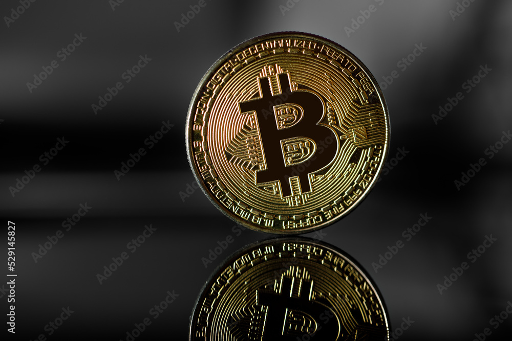 gold bitcoin against the background of the stock price chart gold bitcoin against the background of the stock price chart