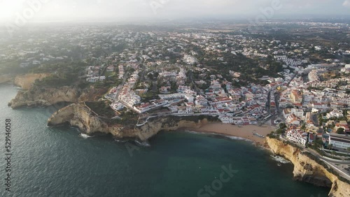 Aerial view of Carvoeiro township, a famous travel destination along the Ocean in the Algarve region, Carvoeiro, Portugal.