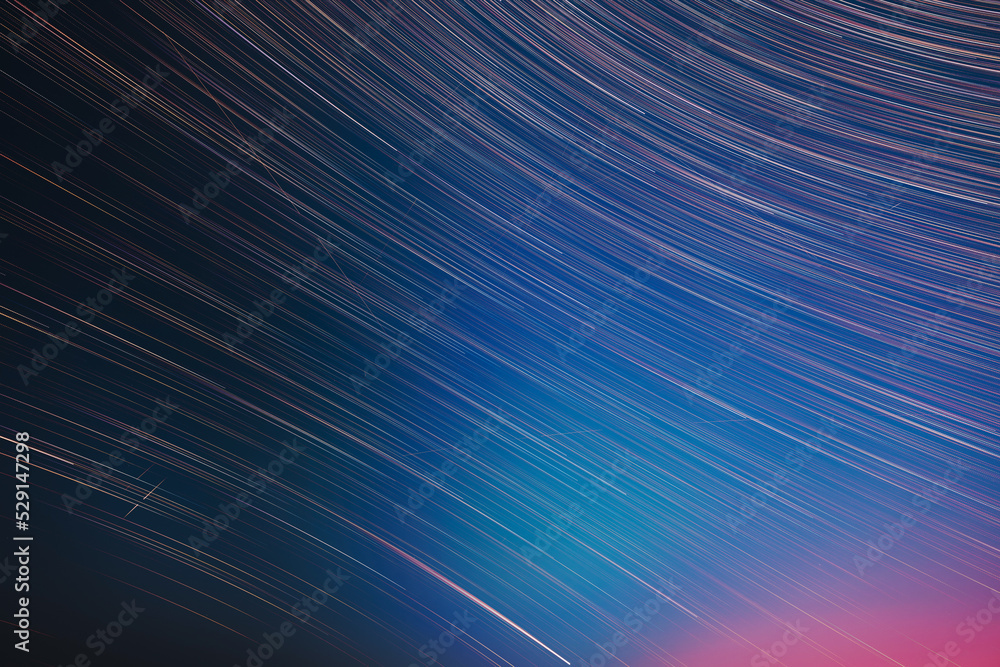 Flight Of Fancy. Abstract Amazing Star Trails On Night Sky Background. Bright Night Starry Sky. Soft Colours. Large Exposure. Imagination, Fantasy, Illusion, Dream View. Saturated Bright Blue, Red